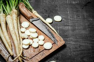 Chopped parsley root. On table photo