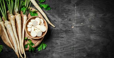 Chopped parsley root. On table photo