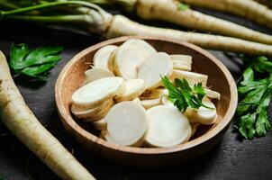 Chopped parsley root. On table photo