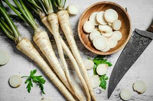 Chopped parsley root. On table photo