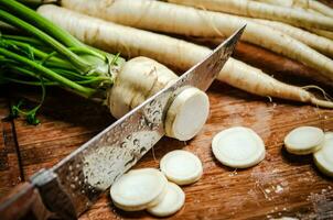 Chopped parsley root. On table photo