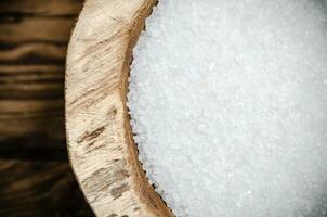 Salt background . On wooden table. photo