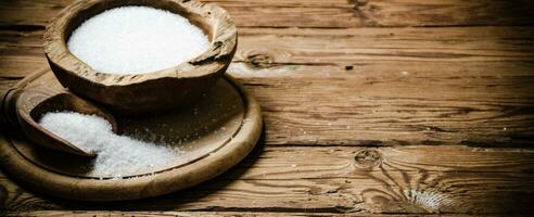 Salt background . On wooden table. photo