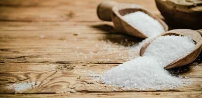 Salt background . On wooden table. photo