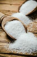 Salt background . On wooden table. photo