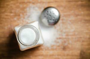 Salt background . On wooden table. photo