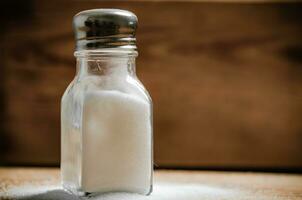 Salt background . On wooden table. photo