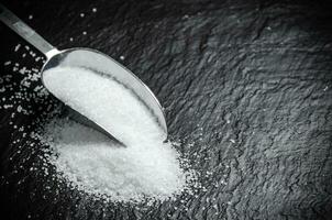 Salt background . On black table. photo