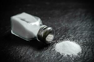 Salt background . On black table. photo