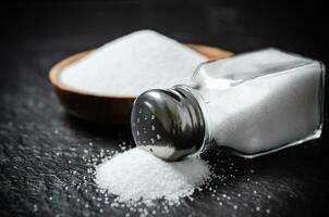 Salt background . On black table. photo