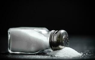 Salt background . On black table. photo