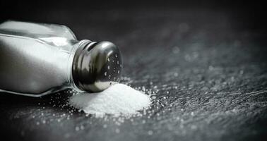 Salt background . On black table. photo