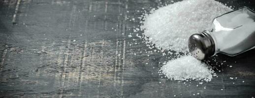 Salt background . On black table. photo
