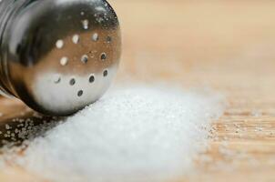 Salt background . On wooden table. photo