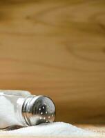 Salt background . On wooden table. photo