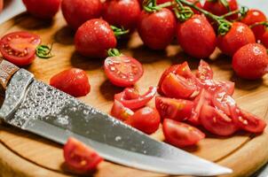 Fresh chopped tomatoes. On cutting board. photo