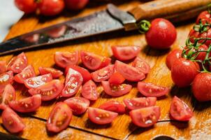 Fresh chopped tomatoes. On cutting board. photo