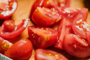 Fresh chopped tomatoes. On cutting board. photo