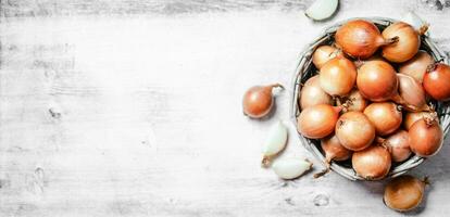 Fresh onions. On table photo