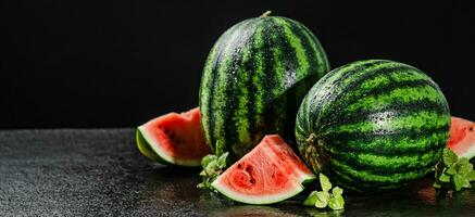 Fresh watermelons on table . photo