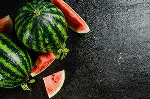 Fresh watermelons on table . photo