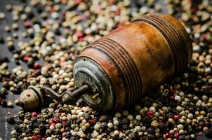 Peppercorn on rustic background. photo
