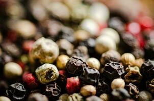 Peppercorn on rustic background. photo