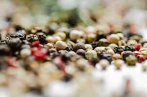 Peppercorn on rustic background. photo