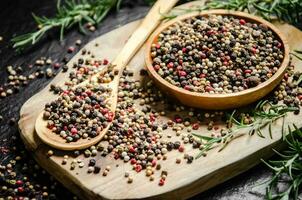 Peppercorn on rustic background. photo