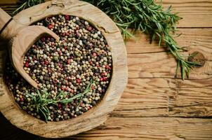 Peppercorn on rustic background. photo