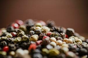 Peppercorn on rustic background. photo