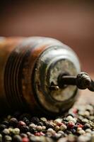 Peppercorn on rustic background. photo