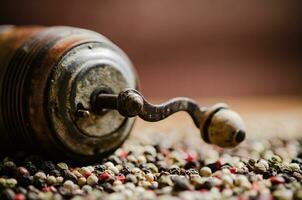 Peppercorn on rustic background. photo