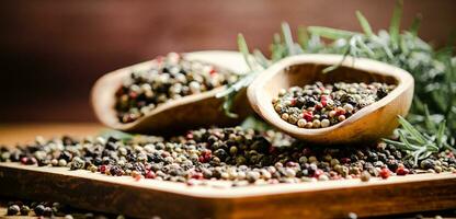 Peppercorn on rustic background. photo