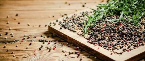 Peppercorn on rustic background. photo