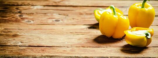 Fresh sweet pepper. On wooden table. photo