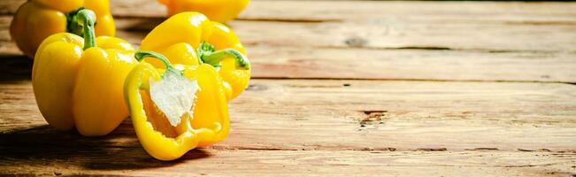 Fresh sweet pepper. On wooden table. photo