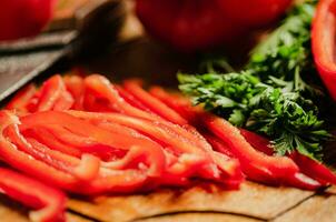 Chopped sweet pepper. On wooden table. photo