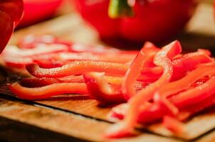 Chopped sweet pepper. On wooden table. photo