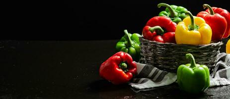 Fresh sweet pepper. On black table. photo