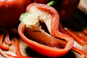 Chopped sweet pepper. On black table. photo