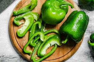 Chopped sweet pepper. On white table. photo