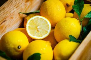 Fresh lemons. On wooden table. photo