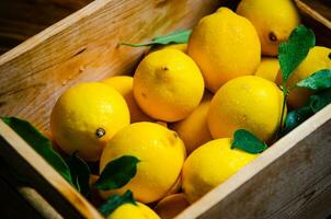 Fresh lemons. On wooden table. photo