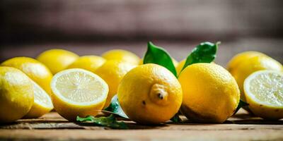 Fresh lemons. On wooden table. photo