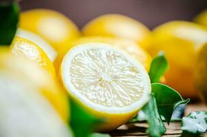 Fresh lemons. On wooden table. photo
