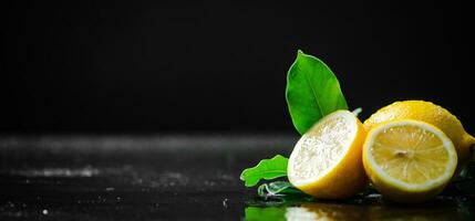 Fresh lemons. On black table. photo