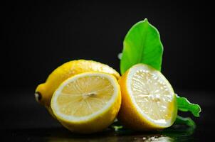 Fresh lemons. On black table. photo