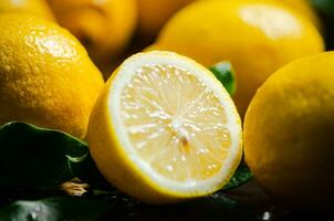 Fresh lemons. On black table. photo