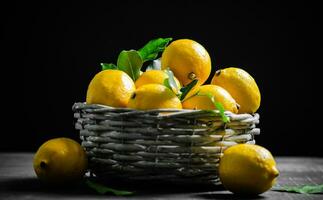 Fresh lemons. On black table. photo